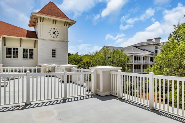 a front view of a house with a fence