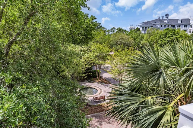 a living room with furniture and a night stand