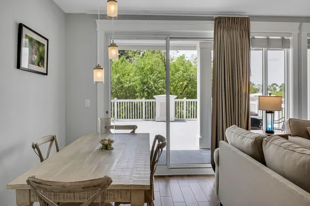 a kitchen with white cabinets and refrigerator