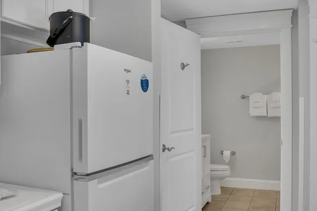 a bathroom with a sink toilet and mirror
