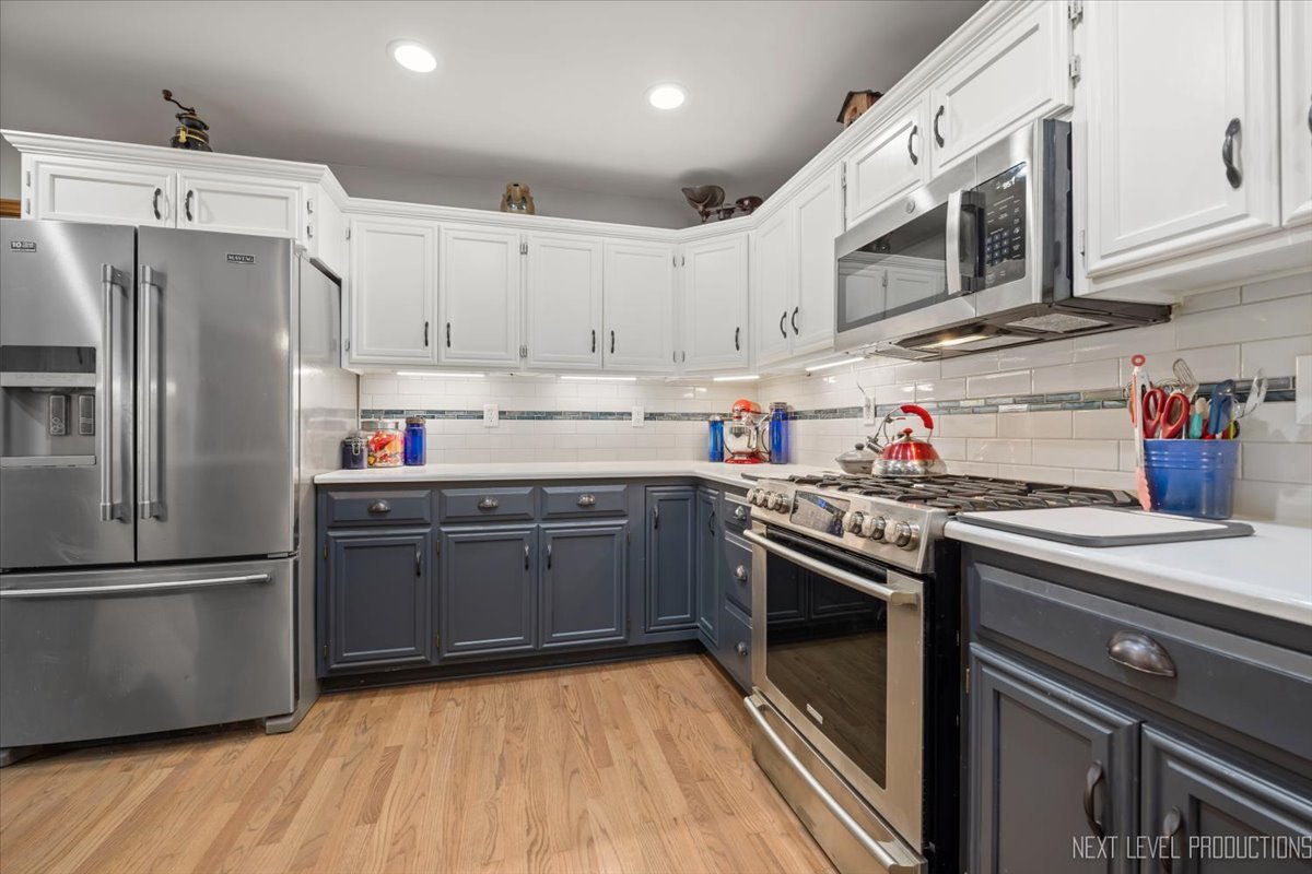 4381 North St Route Leland, IL 60531 - Photo 17 of 36 a kitchen with stainless steel appliances granite countertop a refrigerator sink and cabinets
