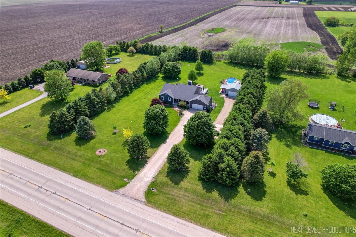4381 North St Route Leland, IL 60531 - Photo 2 of 36 a view of a garden with plants and large trees