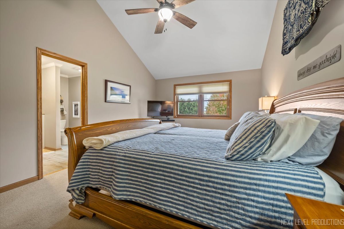 4381 North St Route Leland, IL 60531 - Photo 23 of 36 a bedroom with a bed and a chandelier