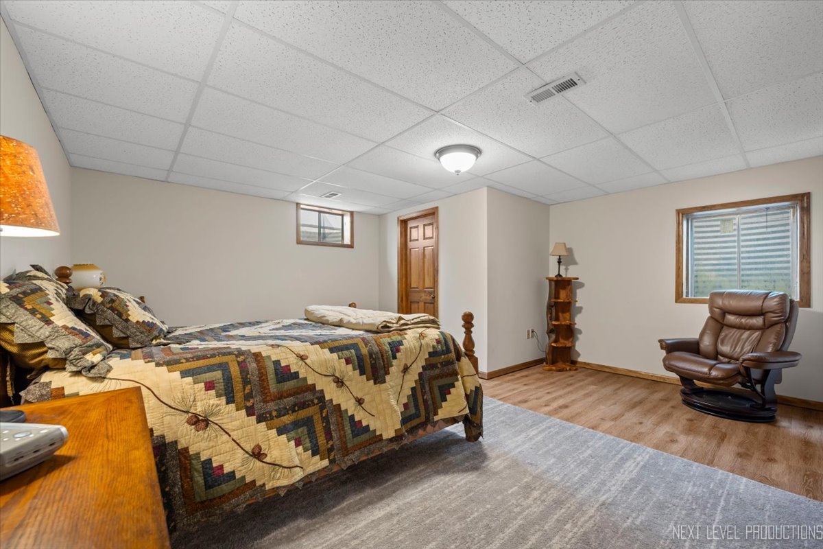 4381 North St Route Leland, IL 60531 - Photo 30 of 36 a bed sitting in a spacious bedroom next to a window