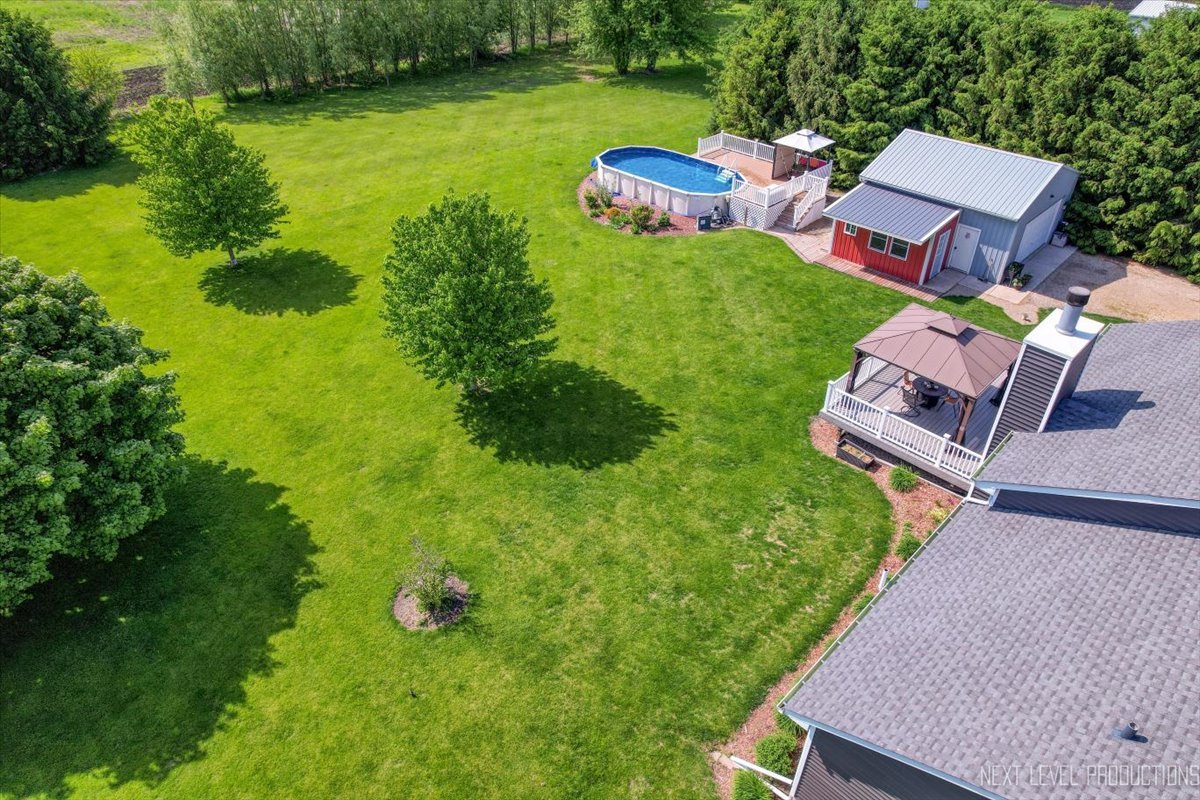 4381 North St Route Leland, IL 60531 - Photo 8 of 36 an aerial view of a house with garden space and street view