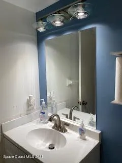 a bathroom with a toilet a sink and a shower