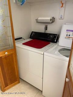 1830 North Atlantic Avenue, Unit 205 Cocoa Beach, FL 32931 - Photo 15 of 28 a utility room with dryer and washer