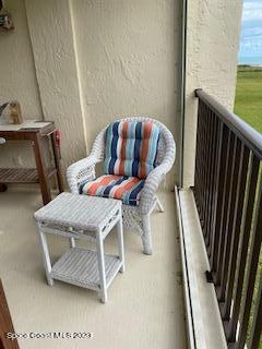 1830 North Atlantic Avenue, Unit 205 Cocoa Beach, FL 32931 - Photo 17 of 28 a living room with furniture