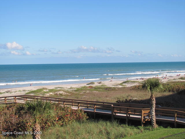 1830 North Atlantic Avenue, Unit 205 Cocoa Beach, FL 32931 - Photo 27 of 28 a view of an ocean from a balcony