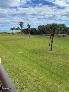 a view of a lake with a yard