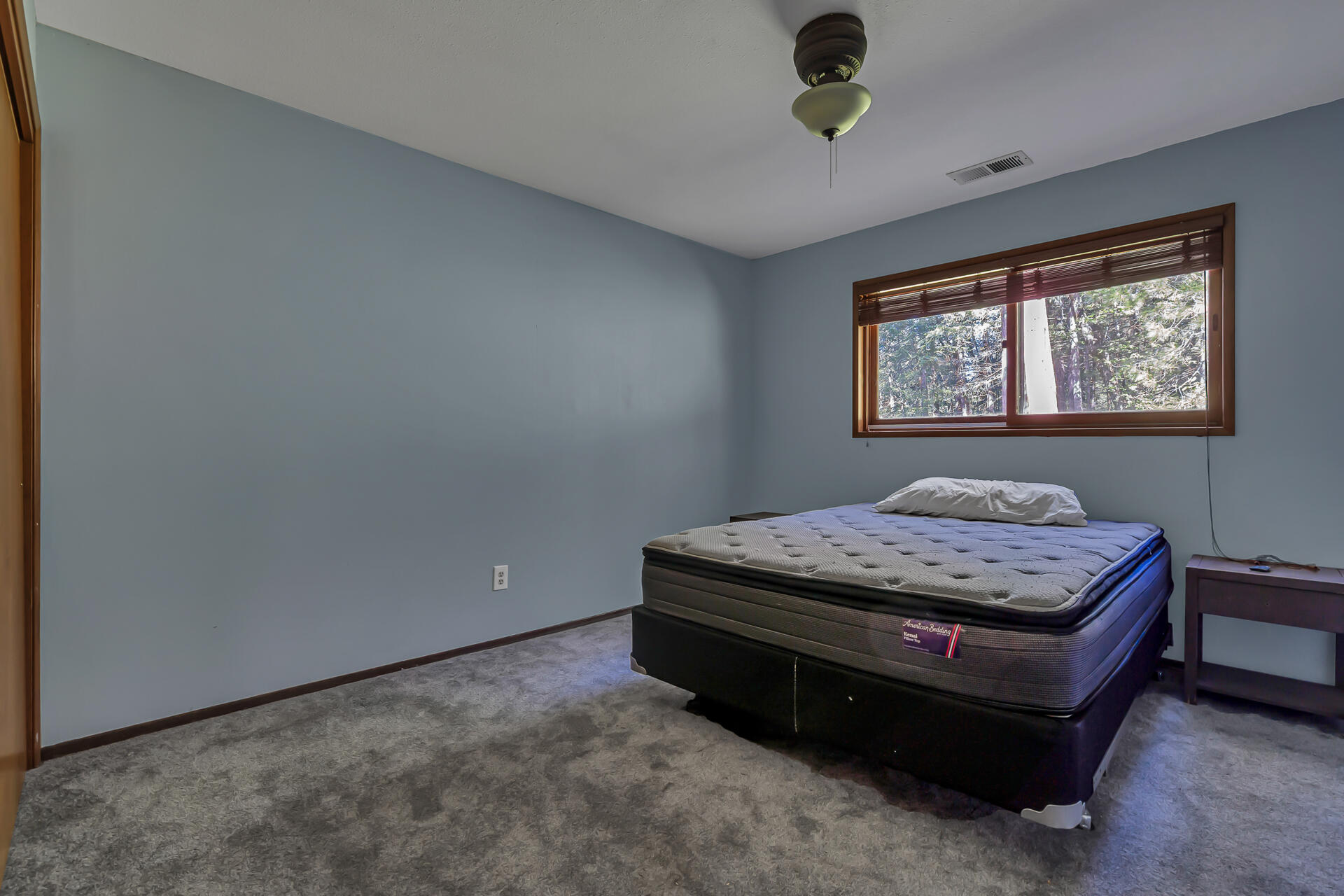 15368 Star Flower Road Oak Run, CA 96069 - Photo 50 of 63 a bedroom with a bed and a window