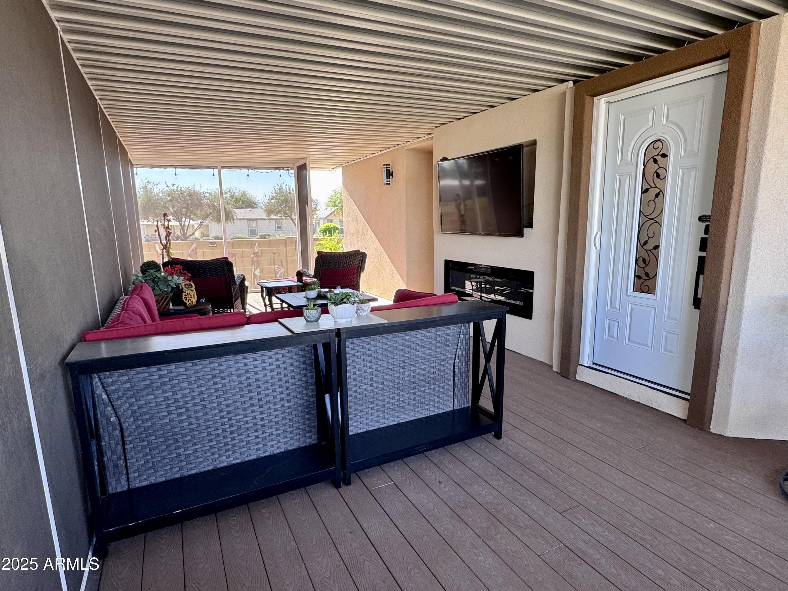 17200 West Bell Road, Unit 454 Surprise, AZ 85374 - Photo 20 of 24 a room with furniture and flat screen tv