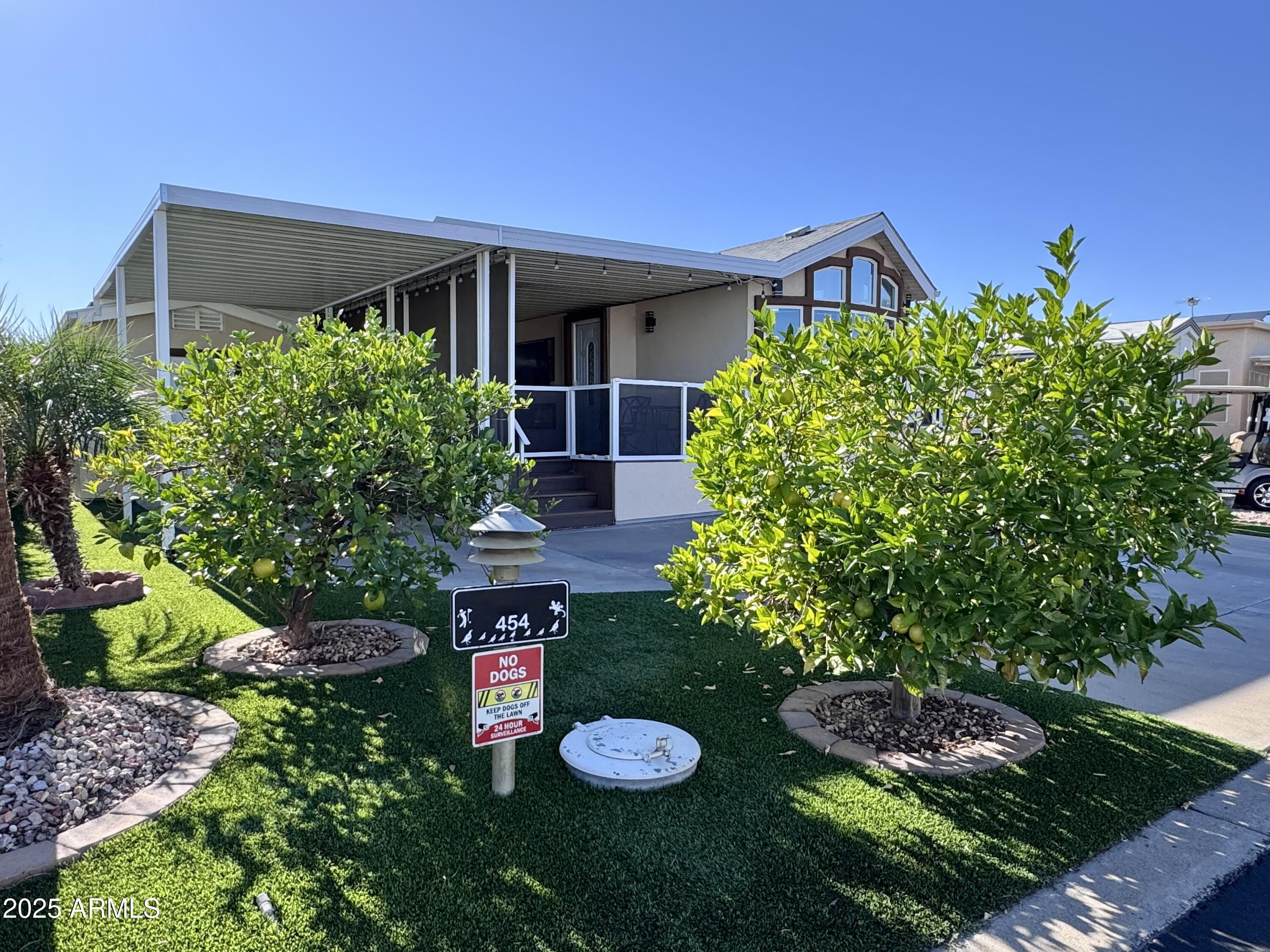 17200 West Bell Road, Unit 454 Surprise, AZ 85374 - Photo 22 of 24 a view of a house with a backyard and garden