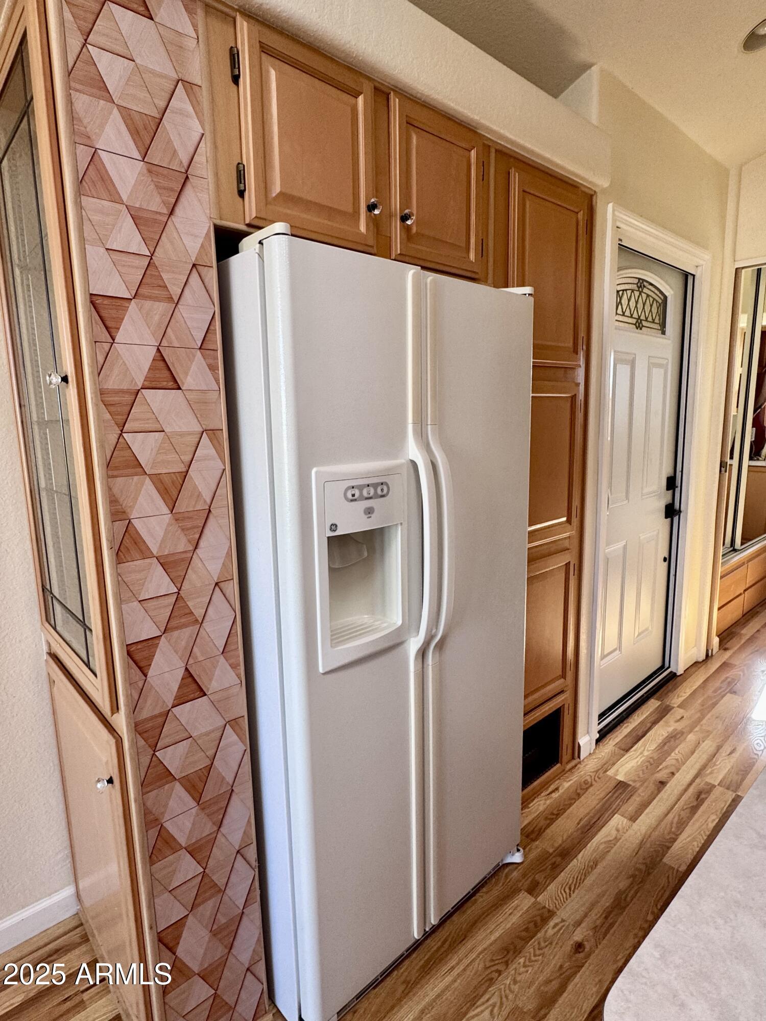 17200 West Bell Road, Unit 454 Surprise, AZ 85374 - Photo 6 of 24 a white refrigerator freezer sitting inside of a kitchen