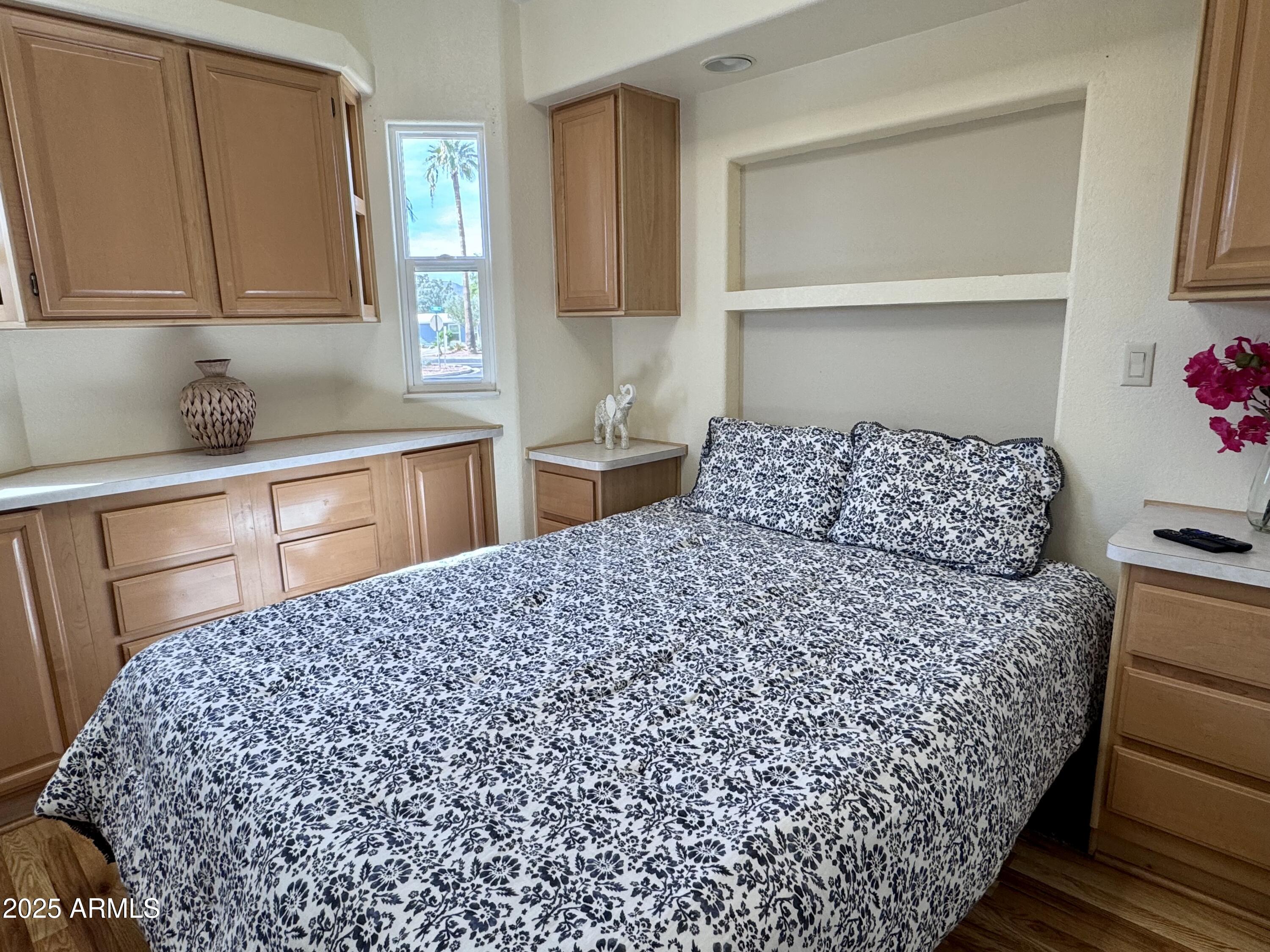 17200 West Bell Road, Unit 454 Surprise, AZ 85374 - Photo 10 of 24 a bedroom with a bed and a window