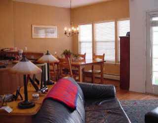 12 Terrace Ridge Boulevard, Unit 12 Edwards, CO 81632 - Photo 1 of 1 a living room with furniture and a chandelier