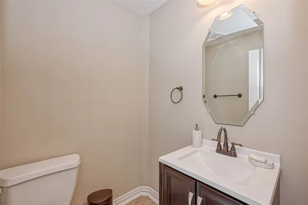 a view of a hallway with a ceiling fan