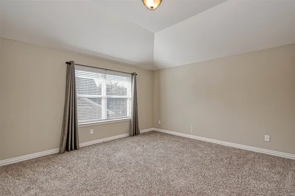a view of a balcony with wooden floor