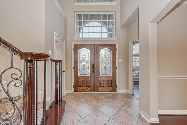 a kitchen with kitchen island granite countertop a sink stove and cabinets