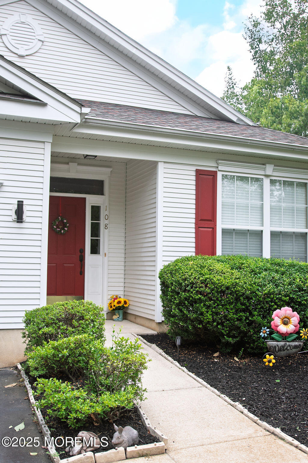 108 Hyannis Court Galloway Township, NJ 08205 - Photo 2 of 22 a front view of a house with a yard and potted plants