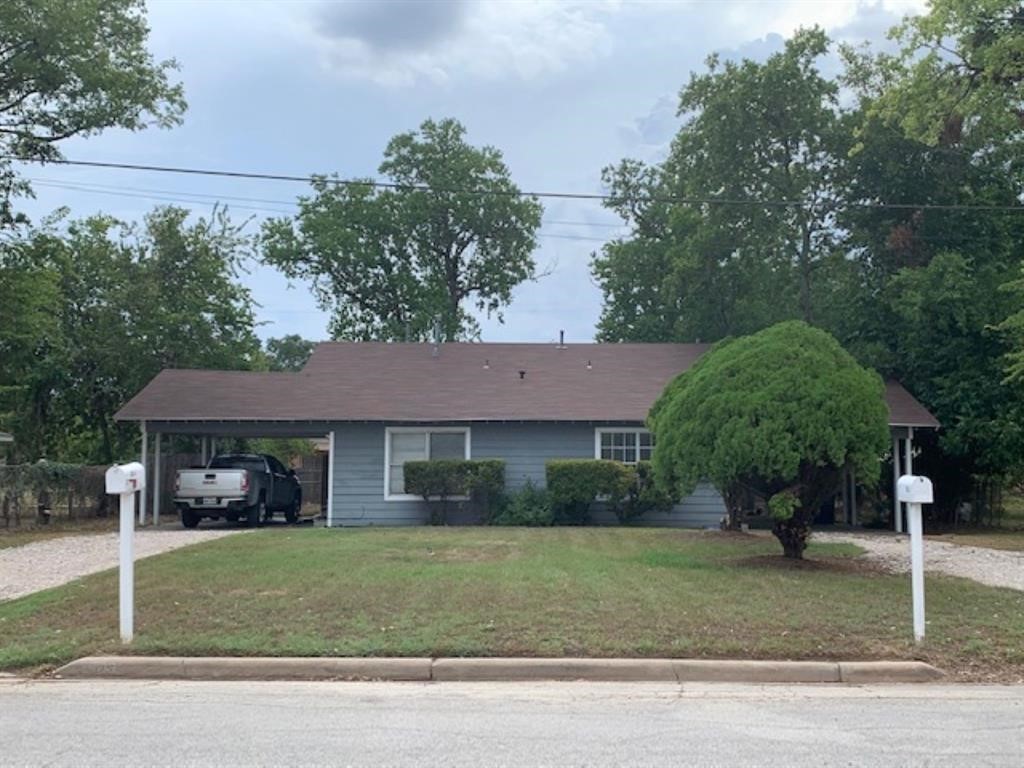 1025 6th Street Hempstead, TX 77445 - Photo 1 of 11 a front view of a house with a yard