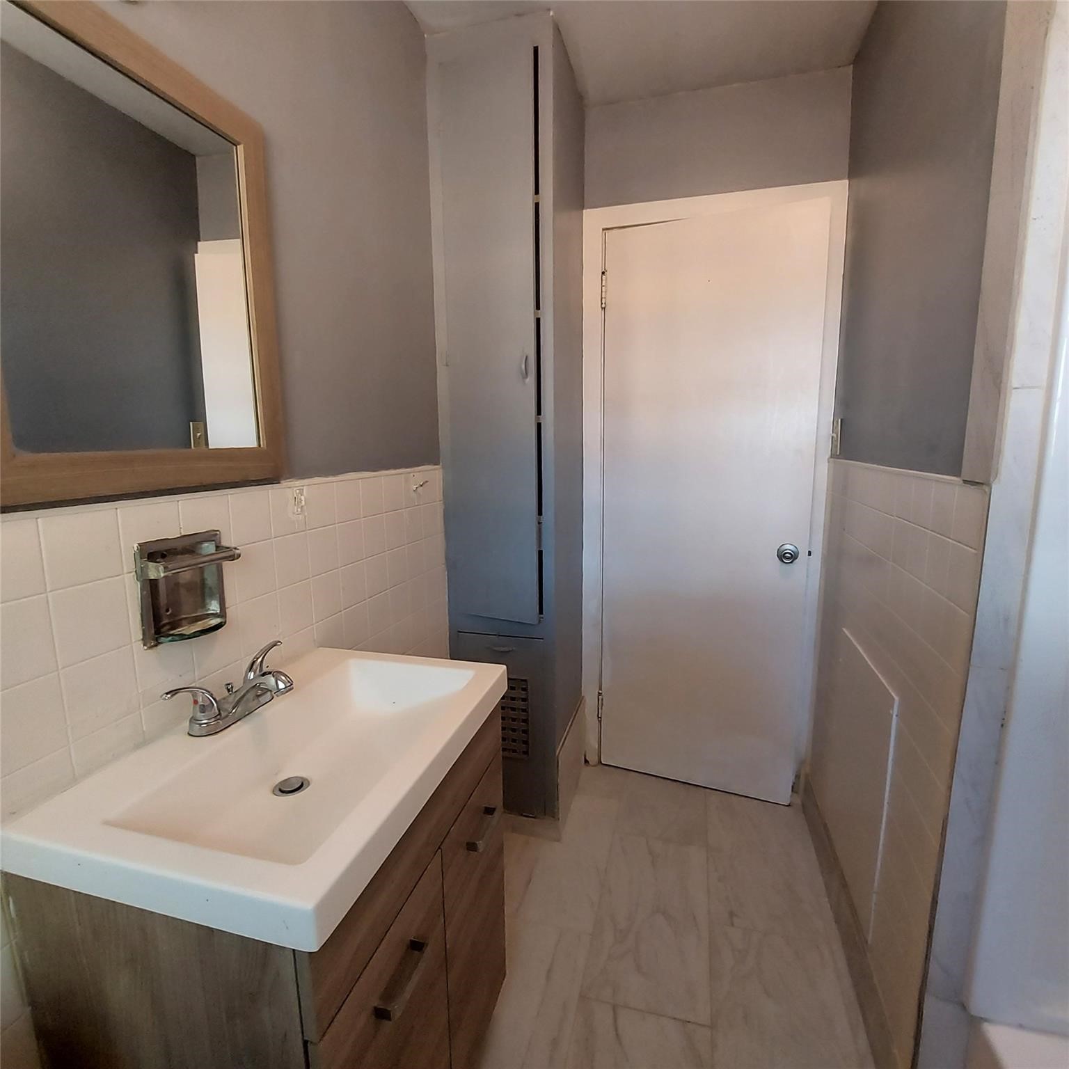 1025 6th Street Hempstead, TX 77445 - Photo 5 of 11 a bathroom with a sink a mirror and a toilet