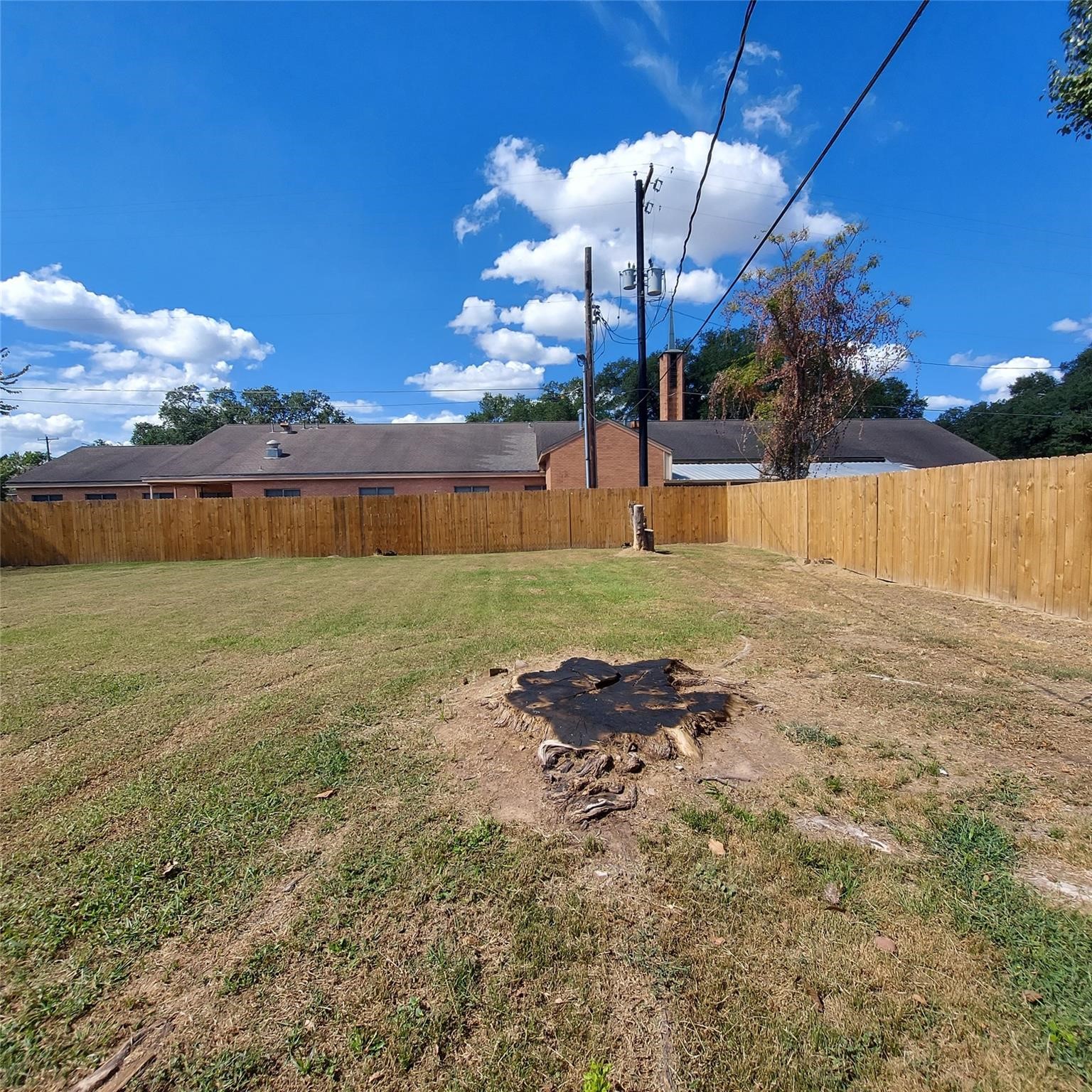 1025 6th Street Hempstead, TX 77445 - Photo 9 of 11 a backyard of a house with table and chairs