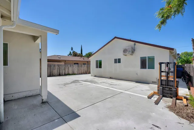 a front view of a house with sitting area