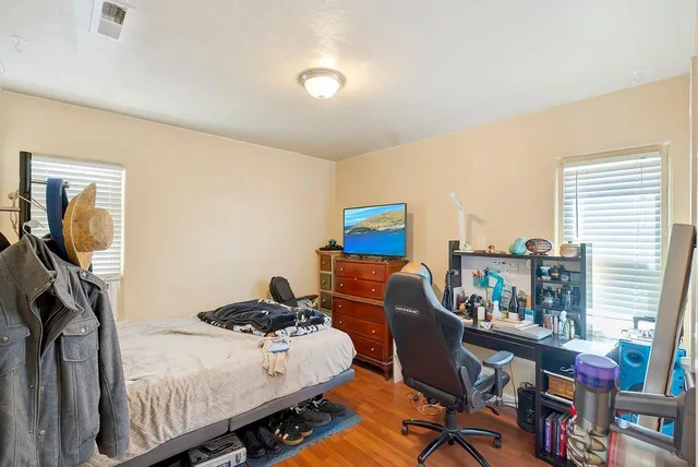 a work room with furniture and a window