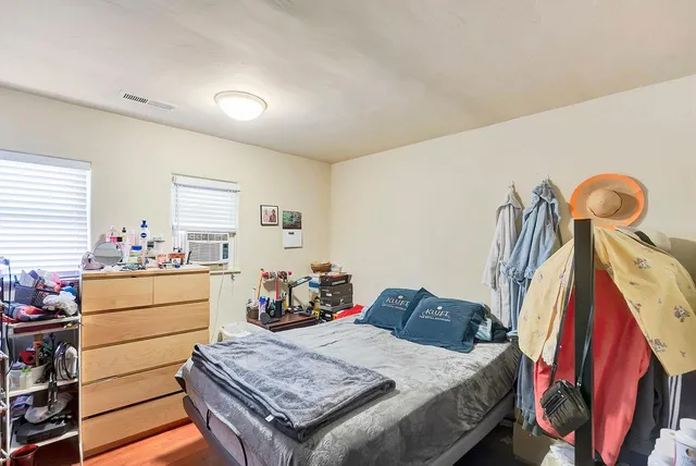 a bed room with a bed and furniture