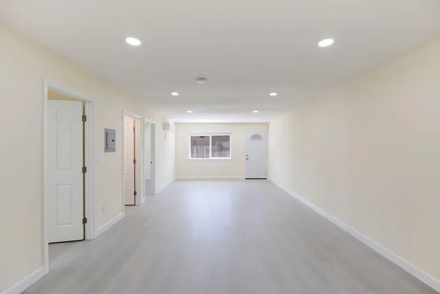 a view of a livingroom with wooden floor