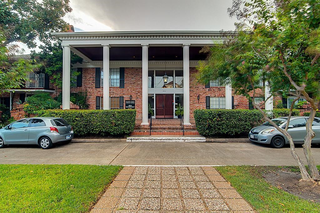 a view of a car parked in front of a building