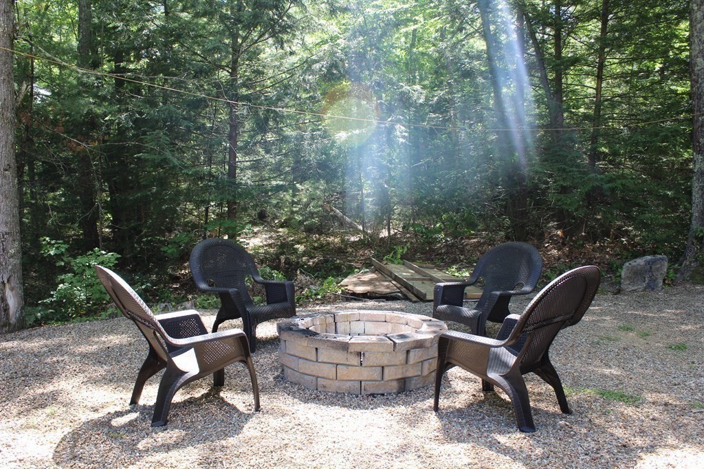 30 Halfrey Road Hubbardston, MA 01452 - Photo 36 of 42 a backyard of a house with table and chairs