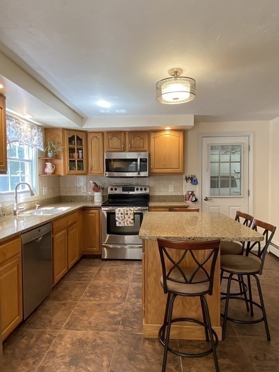 30 Halfrey Road Hubbardston, MA 01452 - Photo 5 of 42 a kitchen with stainless steel appliances a stove a sink dishwasher and a microwave