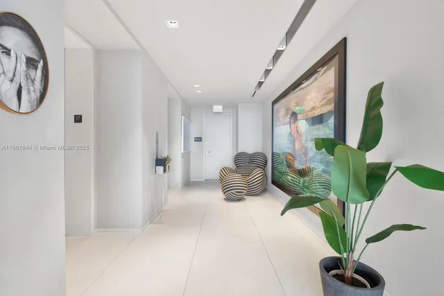a view of a hallway with potted plant