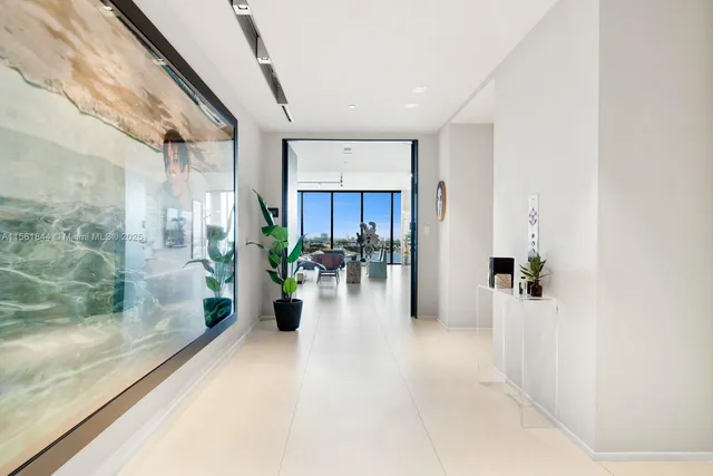 a view of a hallway with potted plants