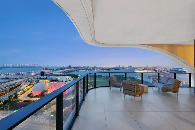 a view of a balcony with furniture