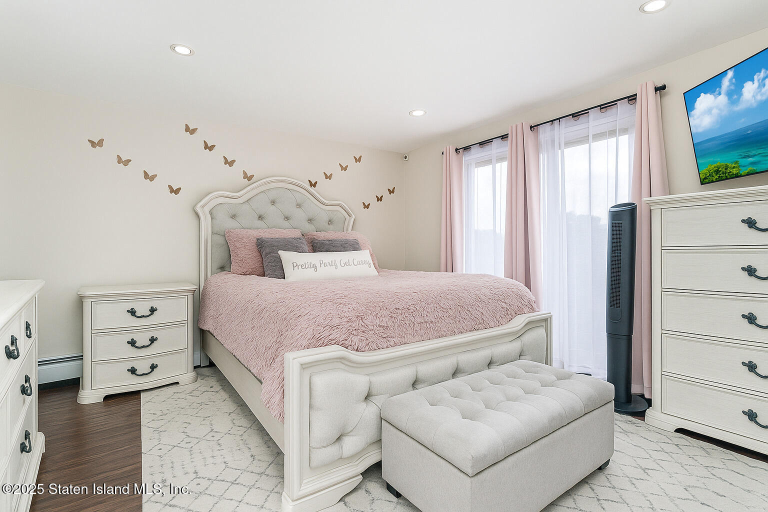 191 Lamberts Lane Staten Island, NY 10314 - Photo 17 of 32 a bedroom with a bed and a flat screen tv