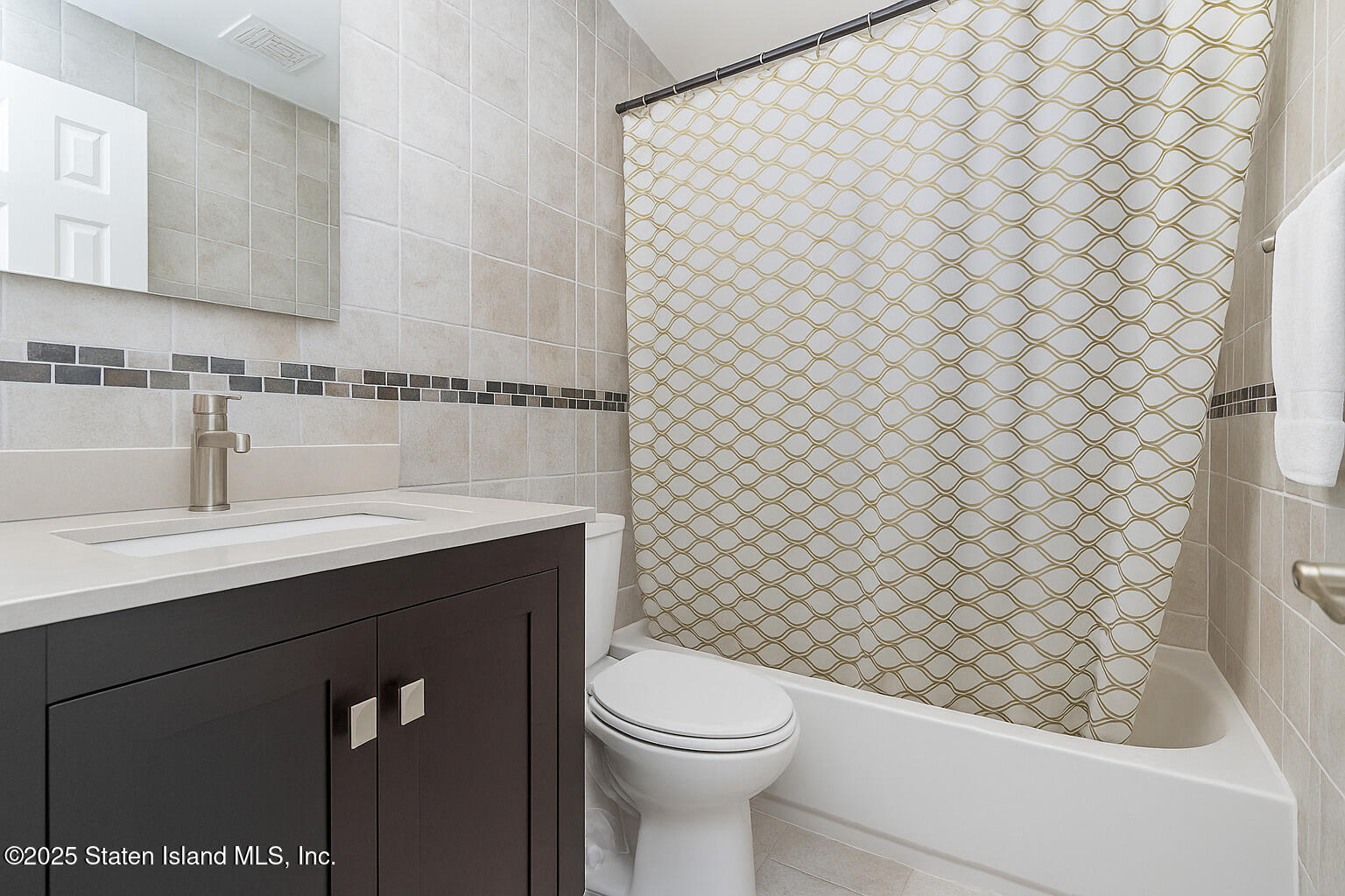 191 Lamberts Lane Staten Island, NY 10314 - Photo 20 of 32 a bathroom with a sink a toilet and shower