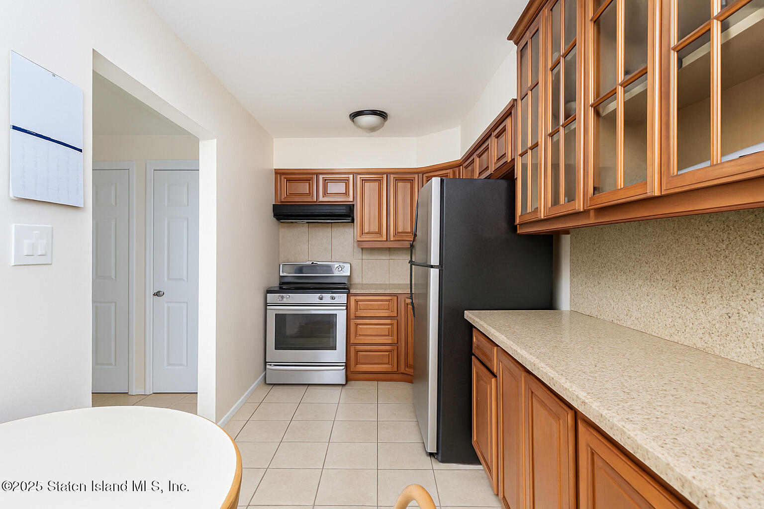 191 Lamberts Lane Staten Island, NY 10314 - Photo 23 of 32 a kitchen with stainless steel appliances a refrigerator and a stove
