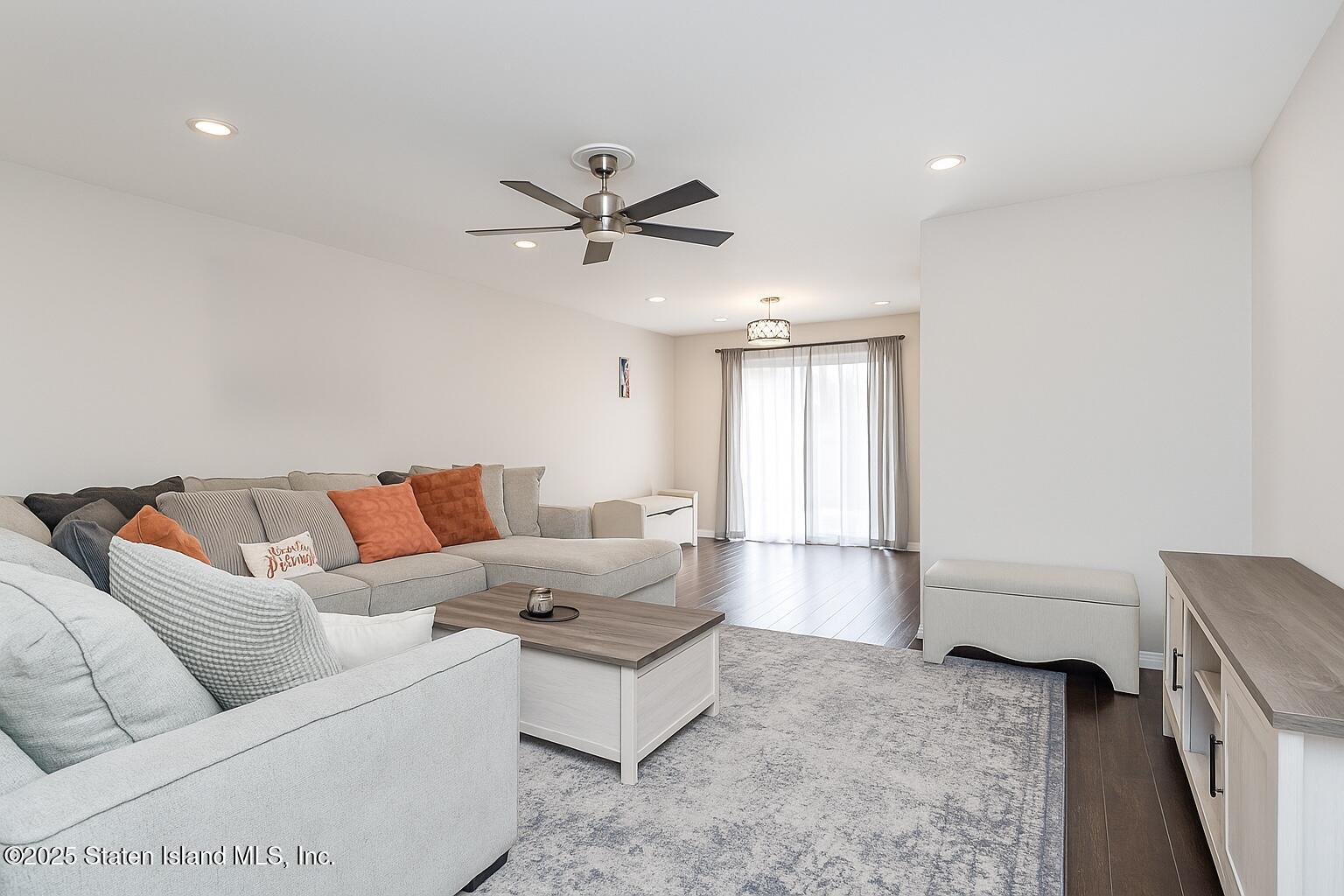 191 Lamberts Lane Staten Island, NY 10314 - Photo 7 of 32 a living room with furniture and a window