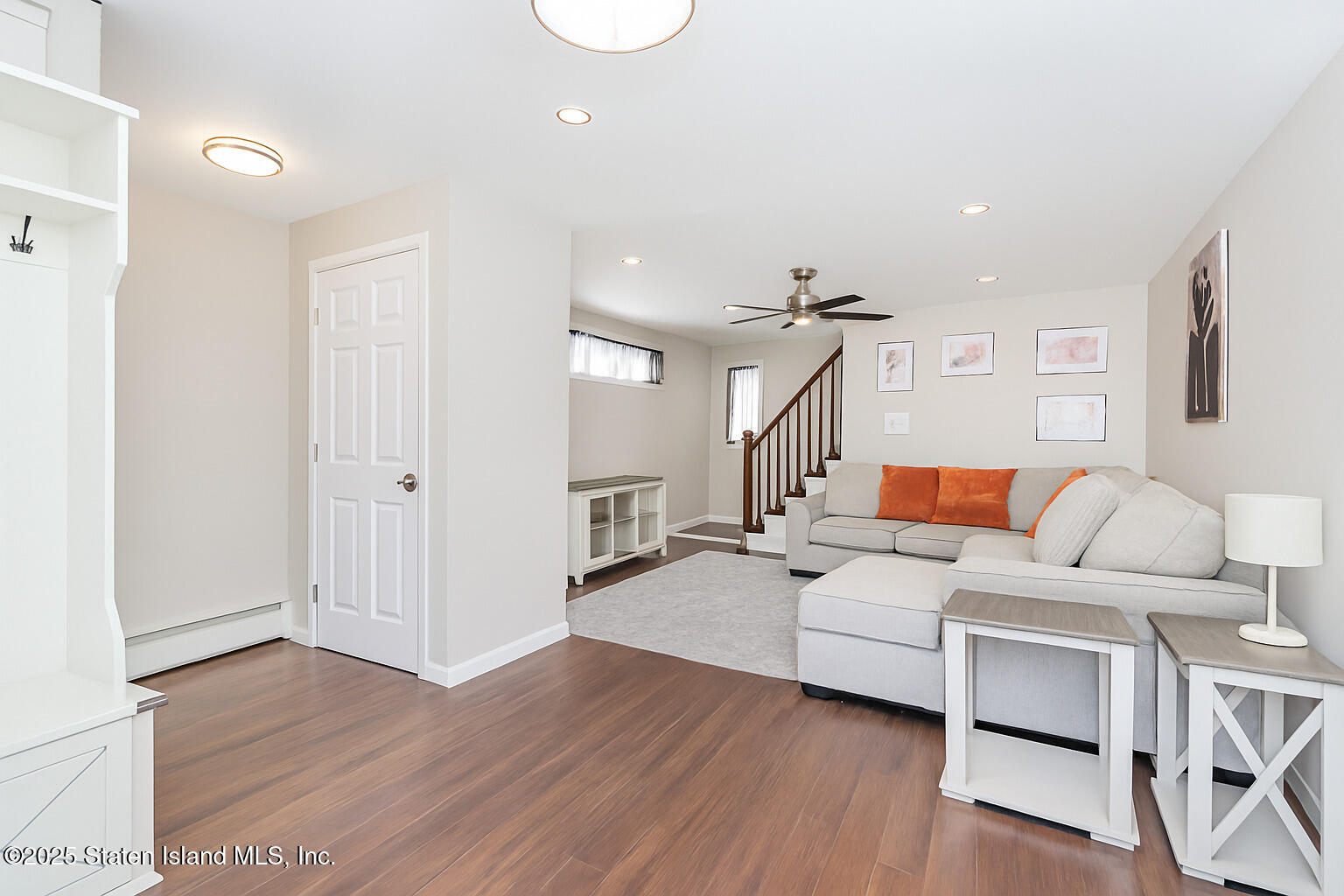 191 Lamberts Lane Staten Island, NY 10314 - Photo 9 of 32 a living room with furniture and a wooden floor