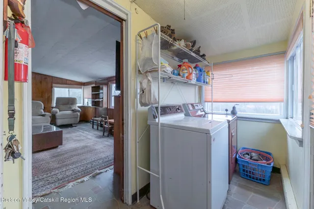 a utility room with closet dryer and washer