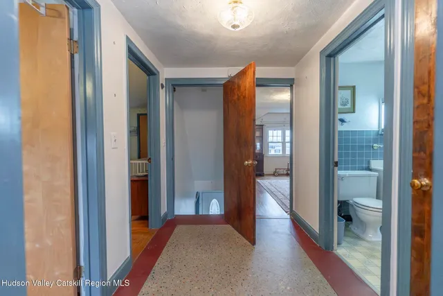 a view of a bathroom from a hallway