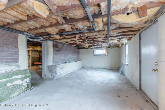 a view of a door with wooden wall