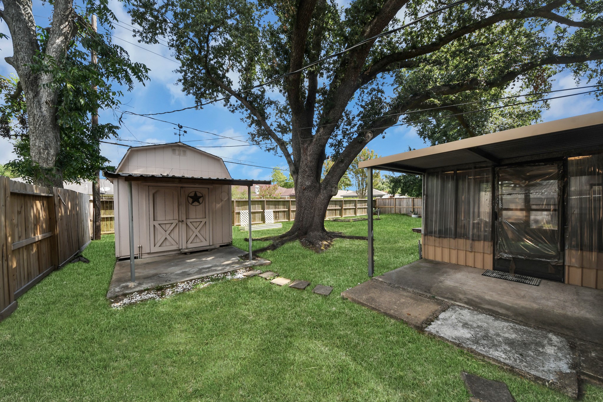 9006 Springview Lane Houston, TX 77080 - Photo 26 of 36 One of the three shed in the backyard comes fully wired and has its own AC.