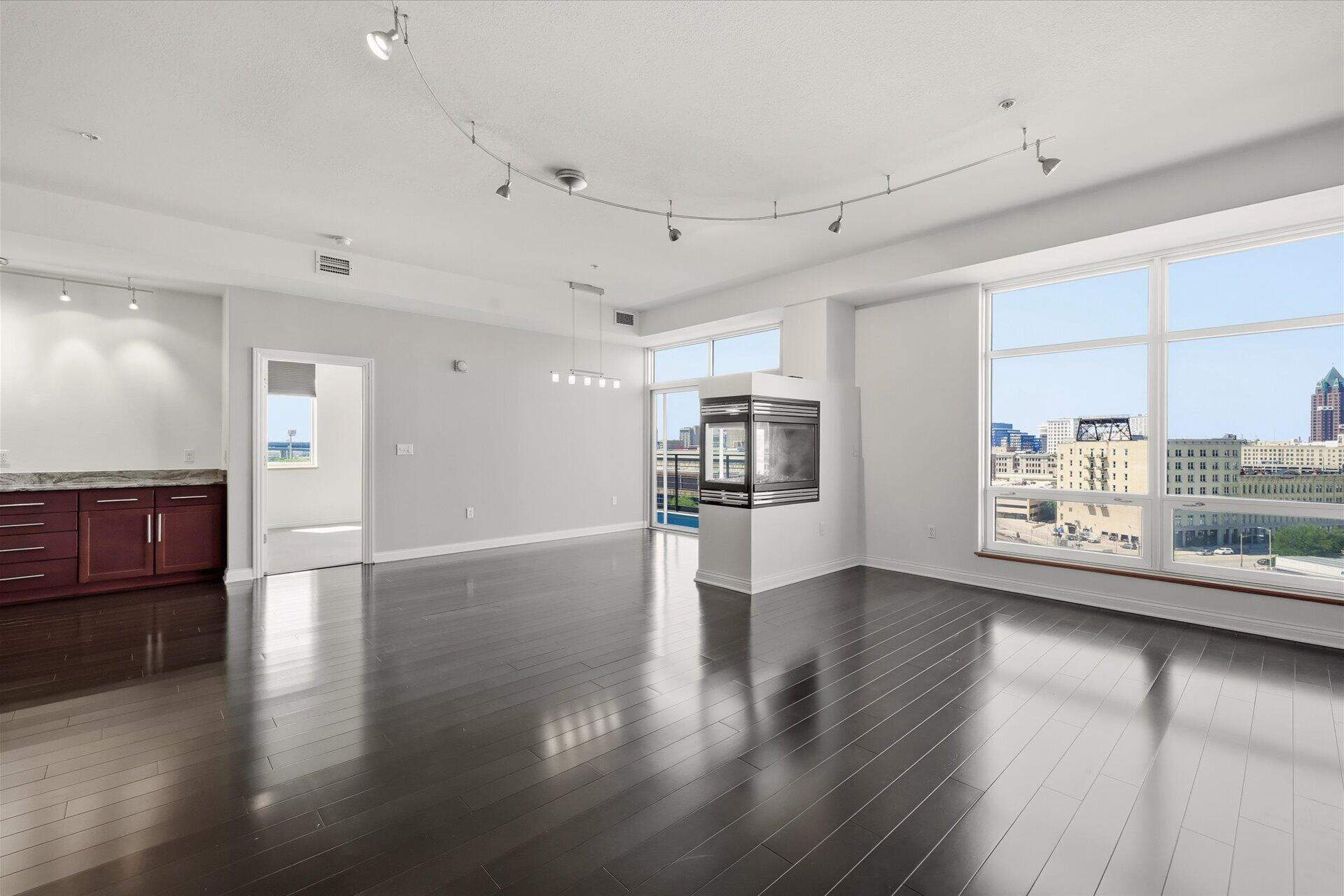 106 West Seeboth Street, Unit 920 Milwaukee, WI 53204 - Photo 12 of 51 10 foot ceilings, hardwood floors, Gas Fireplace