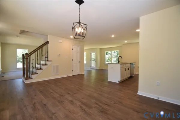 a view of kitchen with microwave and refrigerator