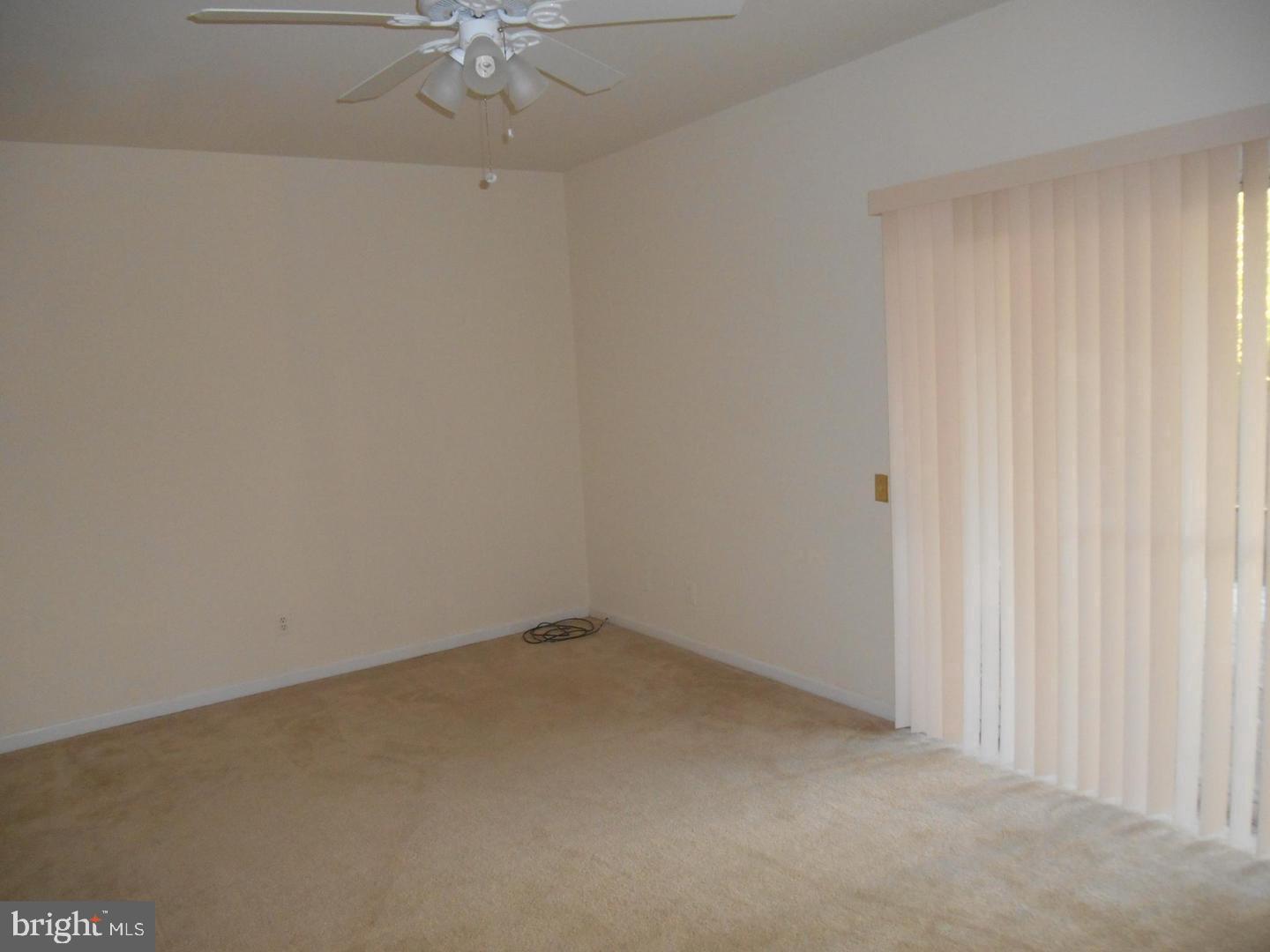 6359 Battlement Way Alexandria, VA 22312 - Photo 16 of 19 an empty room with a ceiling fan and a window