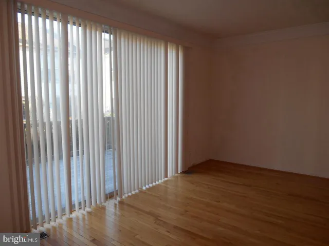 a view of a livingroom with wooden floor